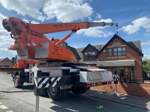 Hot Tub Move - Crane Lifting a hot tub over a house